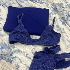 TRAINGL suit. perfect condition. top in small +, bottoms in large (runs small).